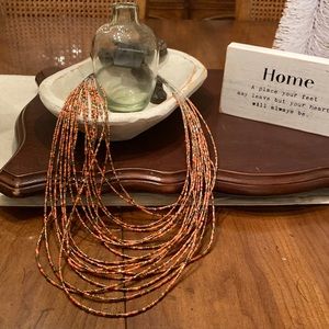 Beautiful multi strand orange, brown, and gold beaded necklace NWT made in India